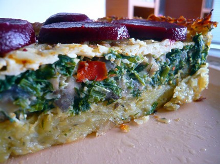 Mushroom quiche with potato crust topped with beetroot