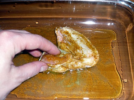 Chicken wing taking an olive oil bath