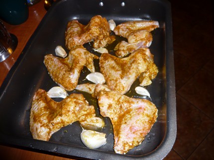 Chicken wings and garlic ready for the oven
