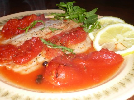 Baked fish fillets with tomatoes